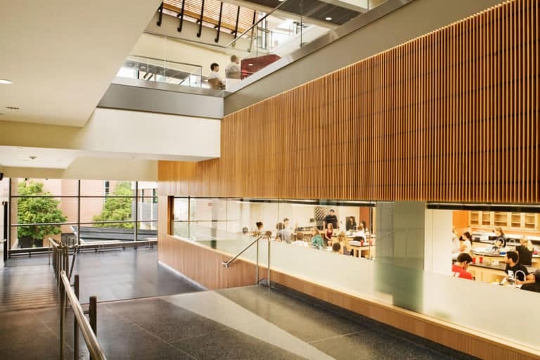 University of Wisconsin Madison Microbial Sciences Building. Corridor with view into training laboratory highlights learning opportunities. Madison, Wisconsin