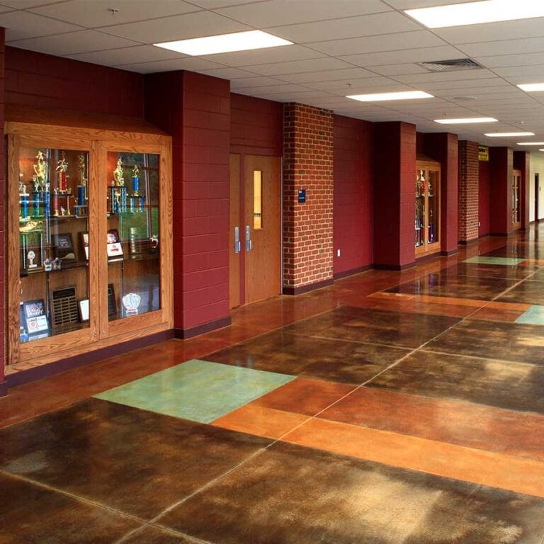 The Gymnasium Lobby at Hales Corners Lutheran Church and School, in Hales Corners, Wisconsin provides easily maintained and durable materials