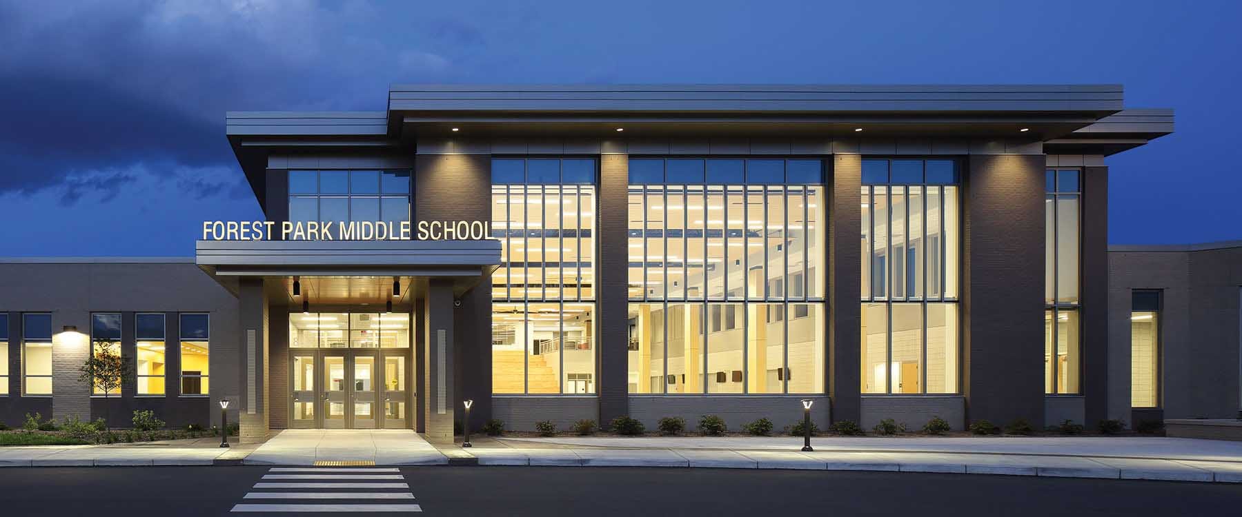 Forest Park Middle School Exterior at night, in Franklin, Wisconsin. Schools must be designed for evening use, as much as for daytime use.