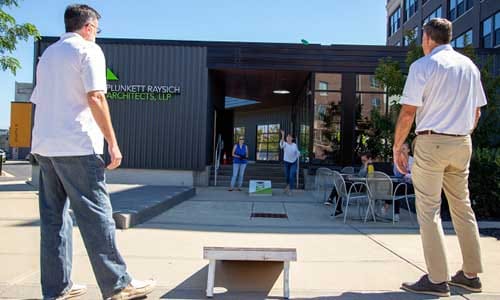 PRA's Annual Cornhole Tournament outside on the PRA Plaza. Rachel Wahlin tosses a bag at the board 